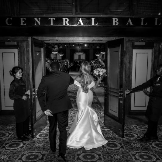 candid black and white wedding photos of grand entrance