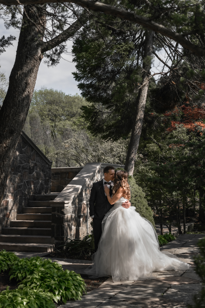 bride groom portrait in spotted light at Graydon Hall