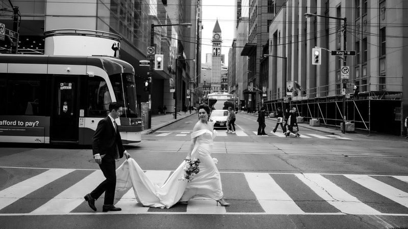 bride groom walking across street in Toronto