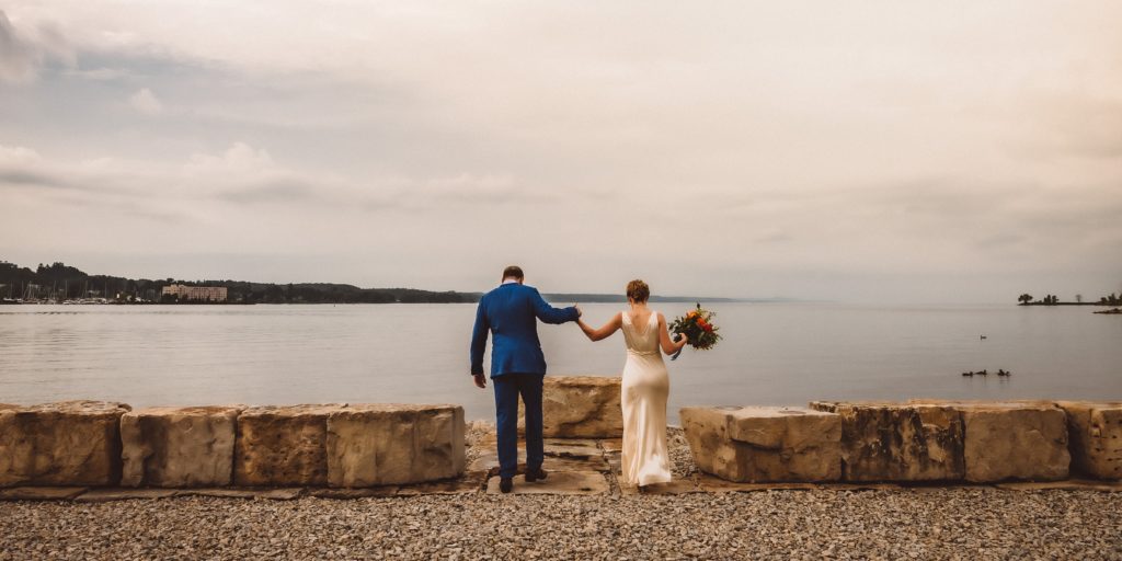 wedding portraits at Best Western inn on the bay