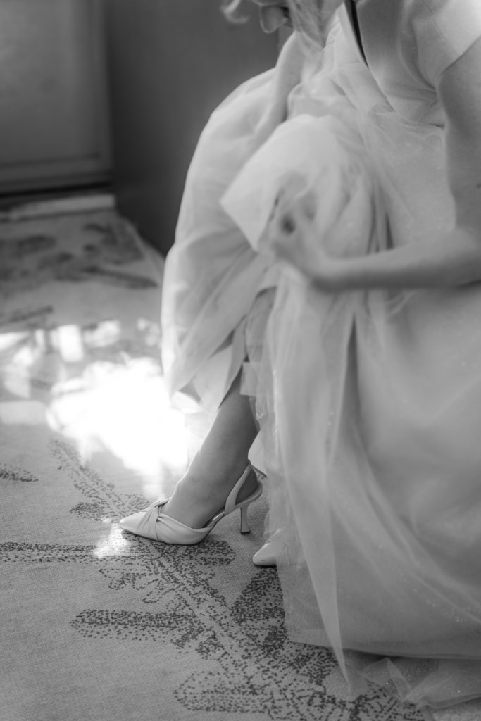 bride putting on her shoes