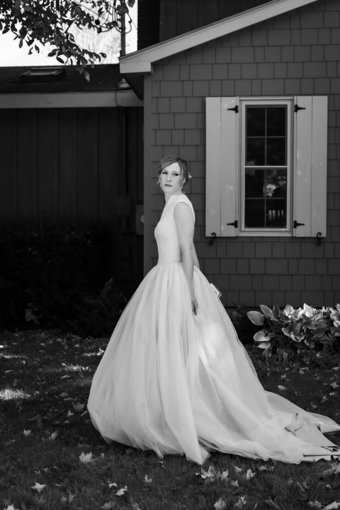 grace kelly inspired ball gown on bride walking to car