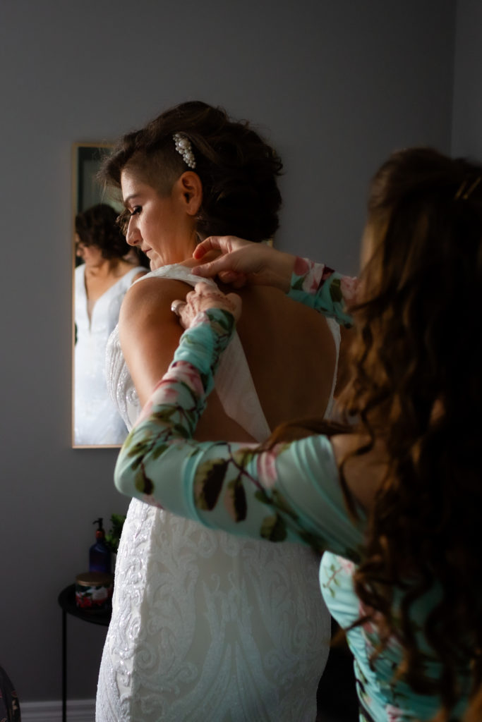 bride and bride getting ready photos together