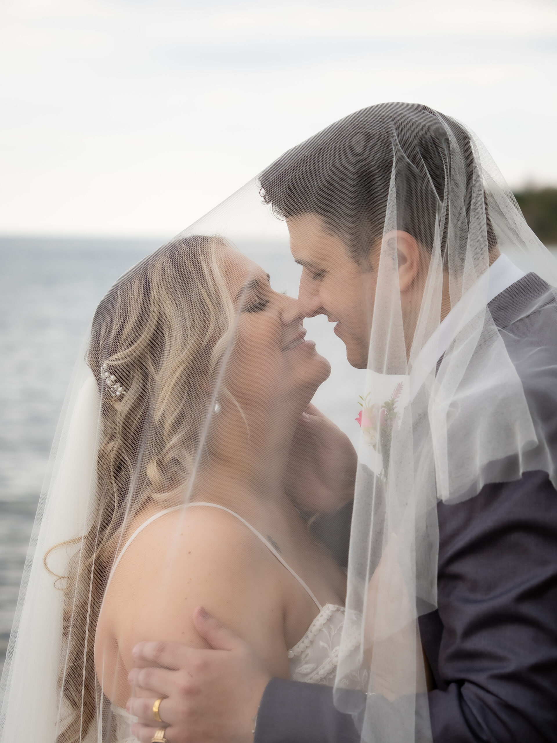 bride groom under veil at serenity cottage wedding