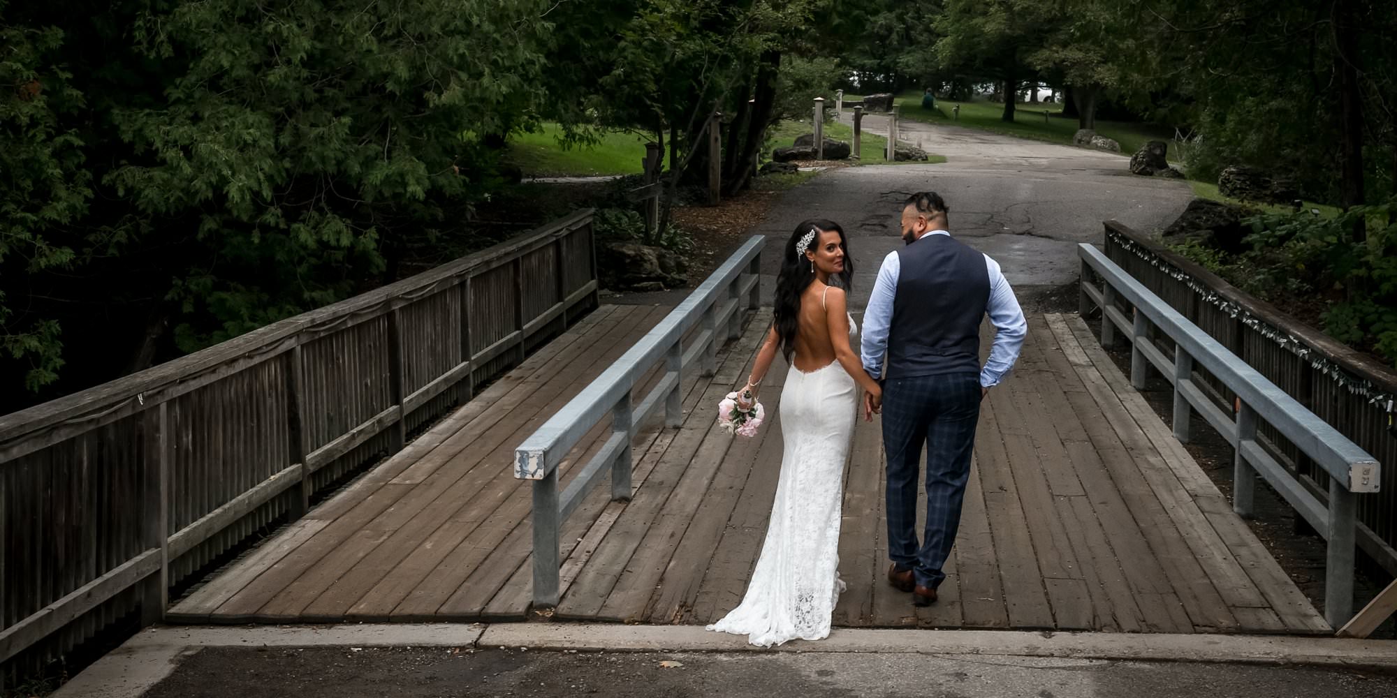 bride and groom photos on the bridge at the millcroft inn