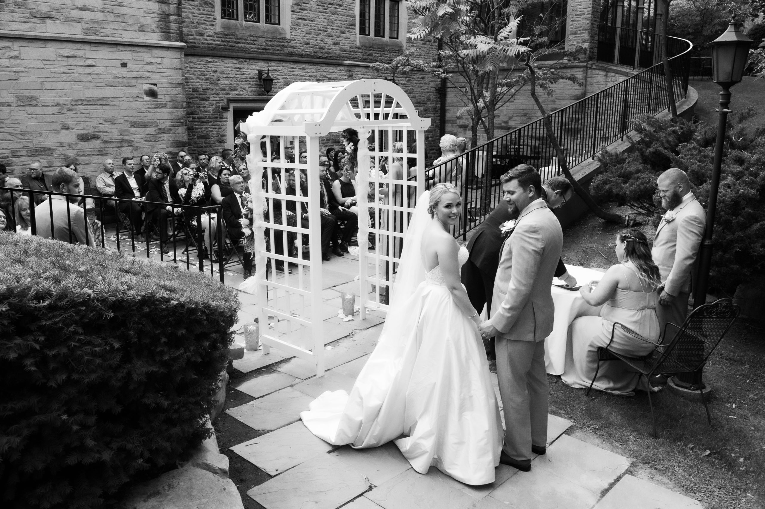 Journalistic wedding photo of bride during ceremony