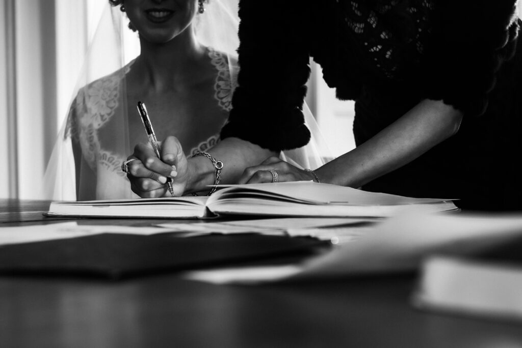 signing the ketubah at Graydon Hall Manor wedding
