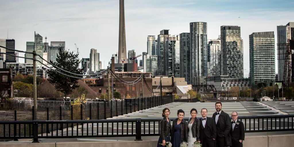 wedding party on bridge with cn tower in background